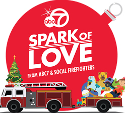 Spark of Love Logo with a Fire Truck and Toys