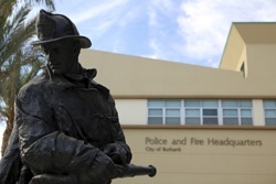 fireman statue and building